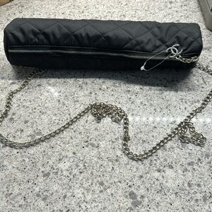 Chanel umbrella cream and black mostly cream with black pattern.